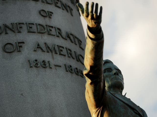 <p> A statue of Confederate President Jefferson Davis, unveild in 1907, stands in the middle of Monument Avenue 23 August, 2017</p>