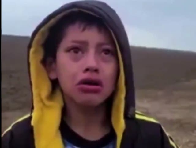 A boy who crossed the border with a group of migrants asks a US Customs and Border Protection guard for help after spending a night in the desert alone.