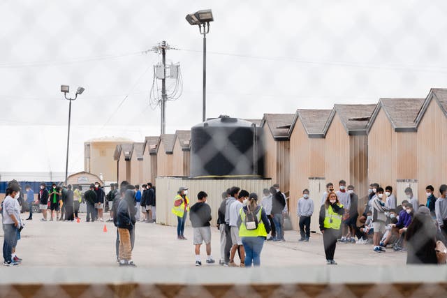 <p>Migrant youths are seen inside the Cotton Logistics oilfield housing that was constructed in 2012 to temporarily house workers in the oil industry in Midland, Texas on April 5, 2021</p>