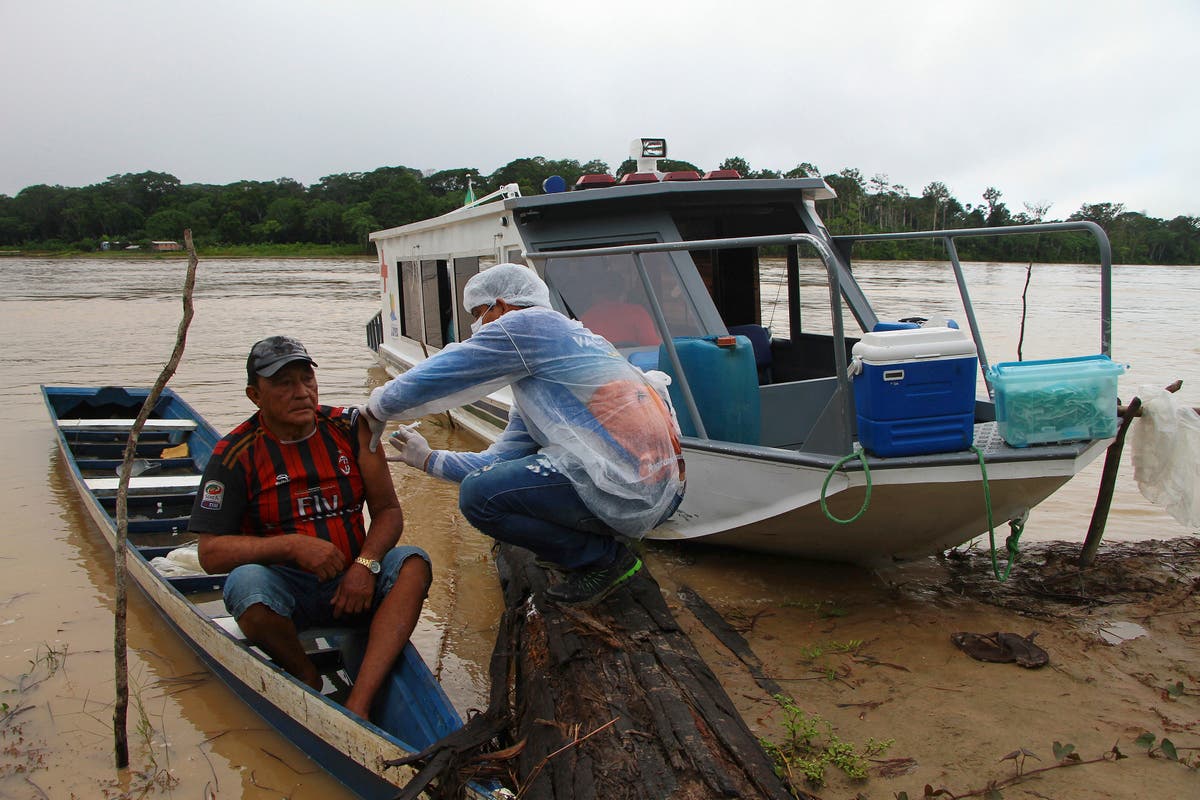 Boat, snowmobile, camel: Vaccine reaches world's far corners