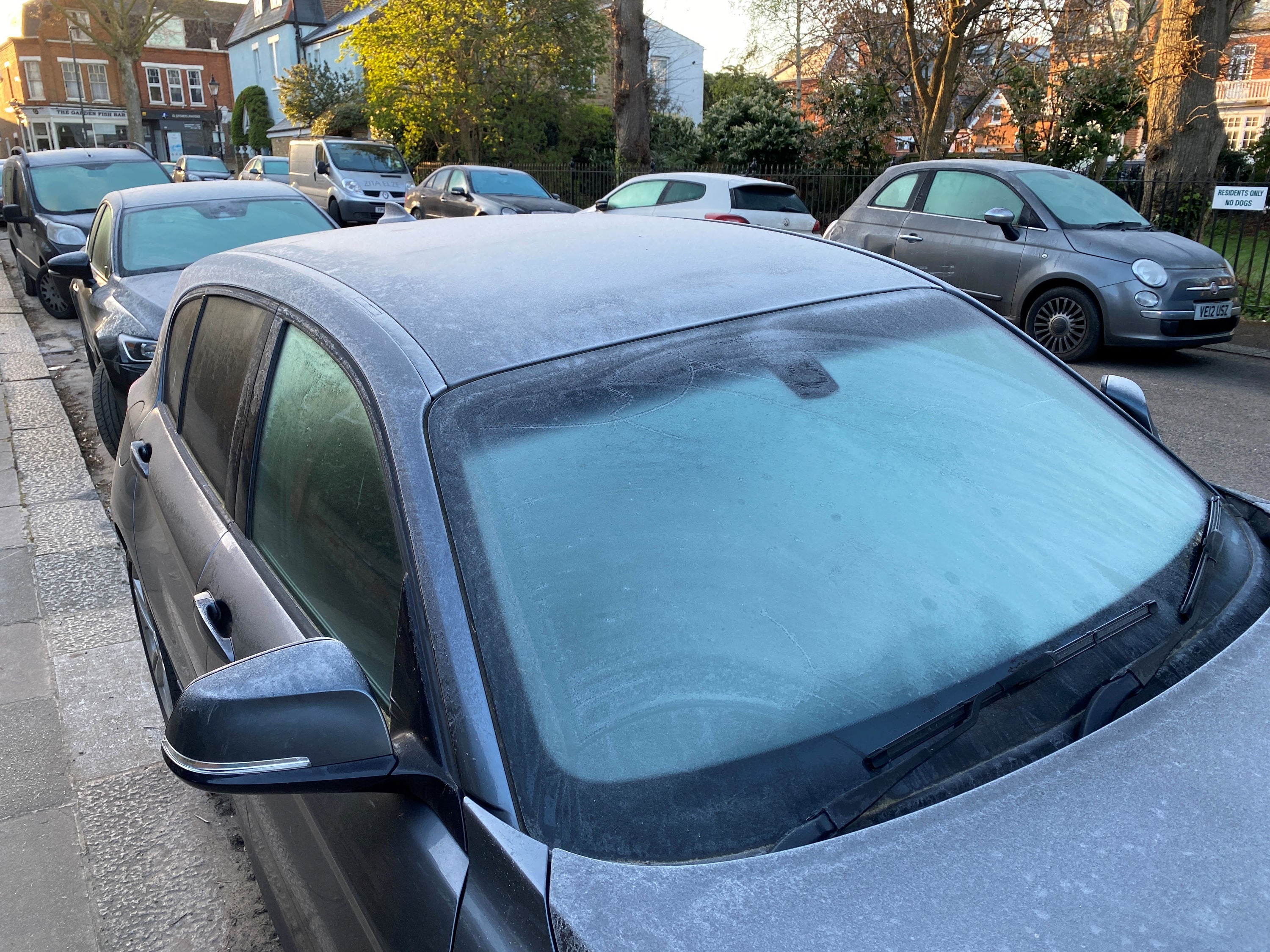 Frost covers cars early in the morning today in Kew, south-west London