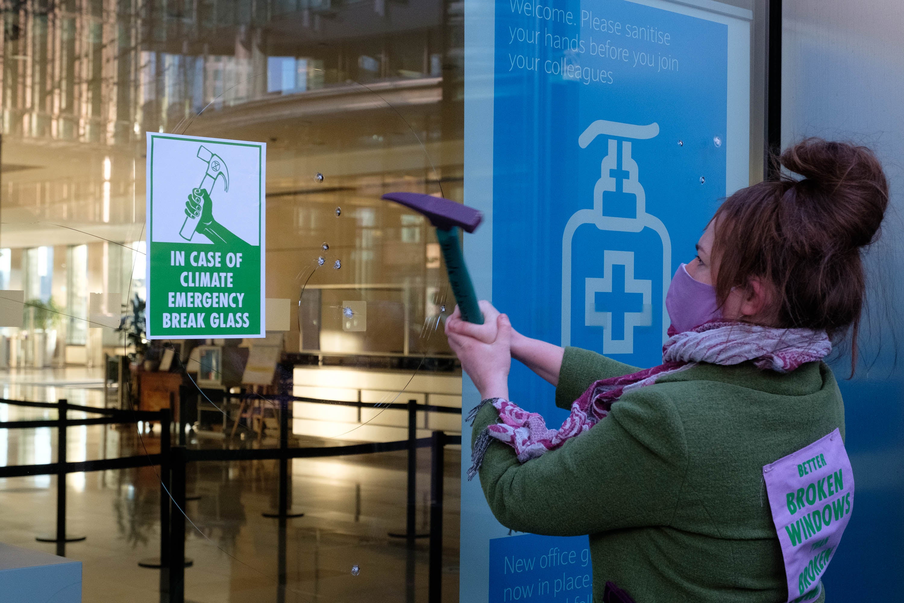 Photo issued by Extinction Rebellion of their protest at Barclays, where they used hammers and chisels to break windows
