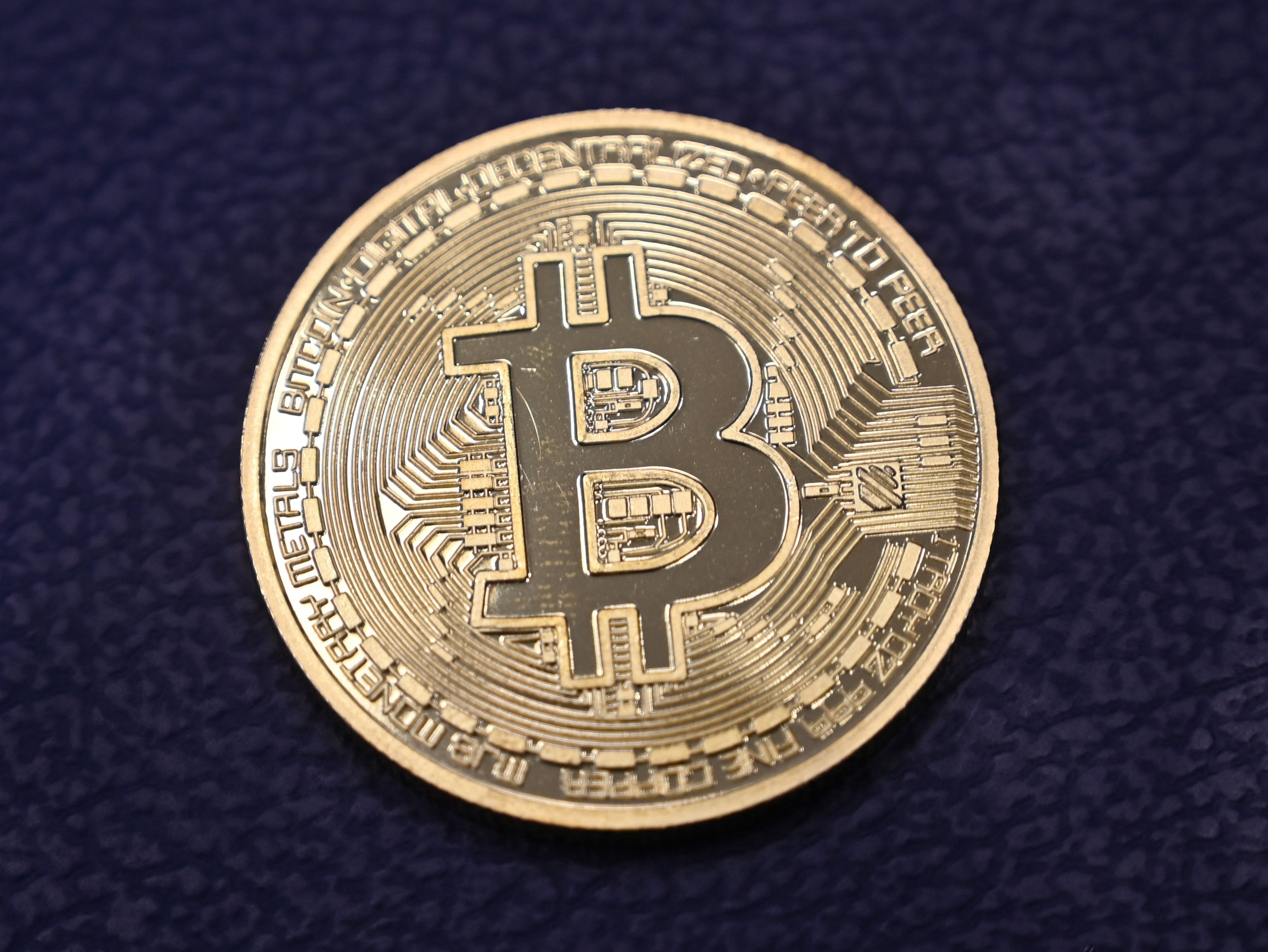 <p>Physical imitation of a Bitcoin at a crypto currency “Bitcoin Change” shop, near Grand Bazaar, in Istanbul</p>