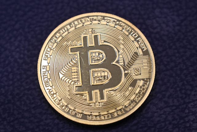 <p>Physical imitation of a Bitcoin at a crypto currency “Bitcoin Change” shop, near Grand Bazaar, in Istanbul</p>