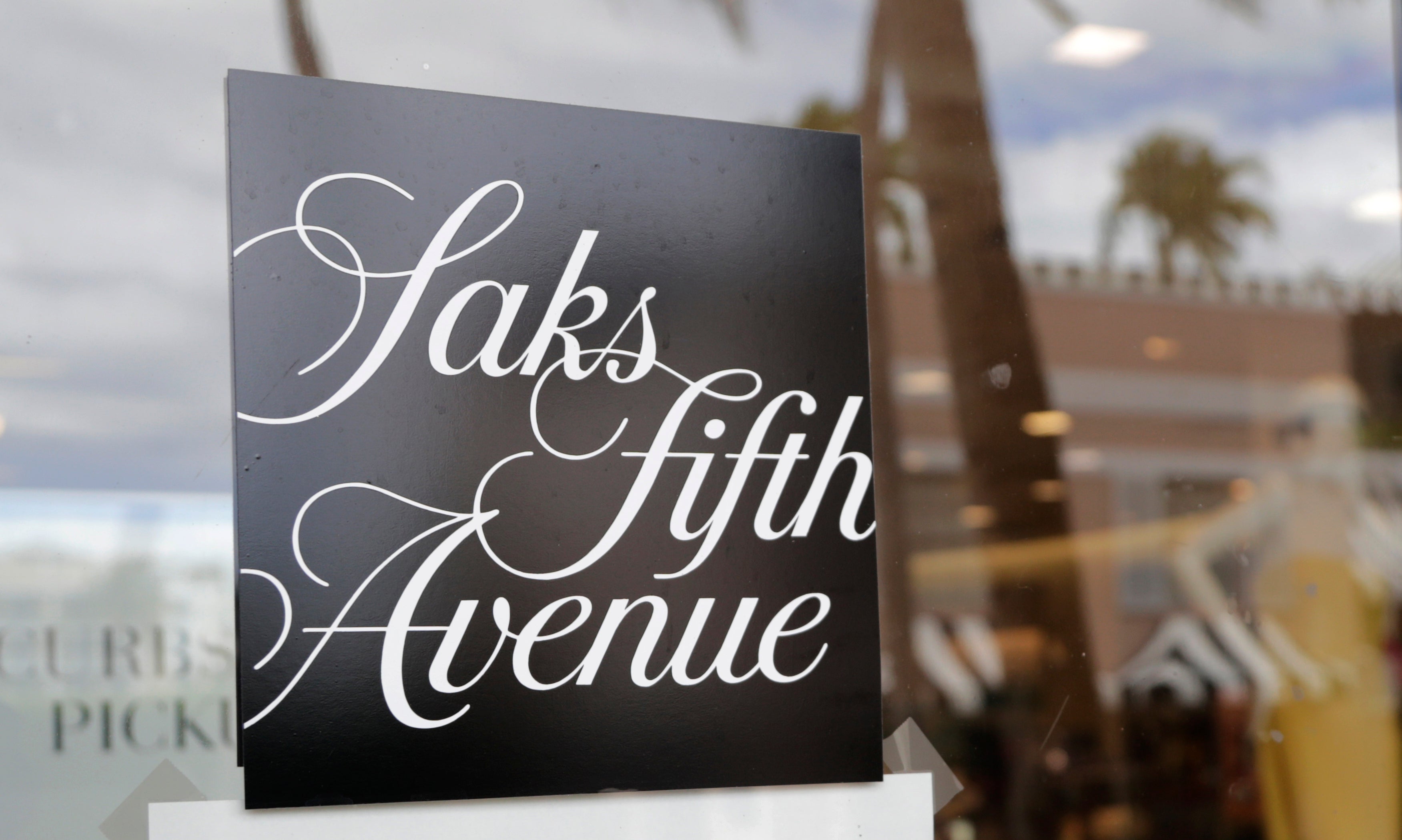 The parent company of department store chain Saks Fifth Avenue has agreed to buy luxury retailer Neiman Marcus