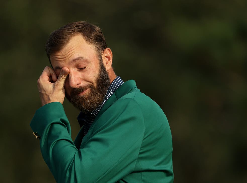<p>Dustin Johnson tears up during his acceptance speech</p>