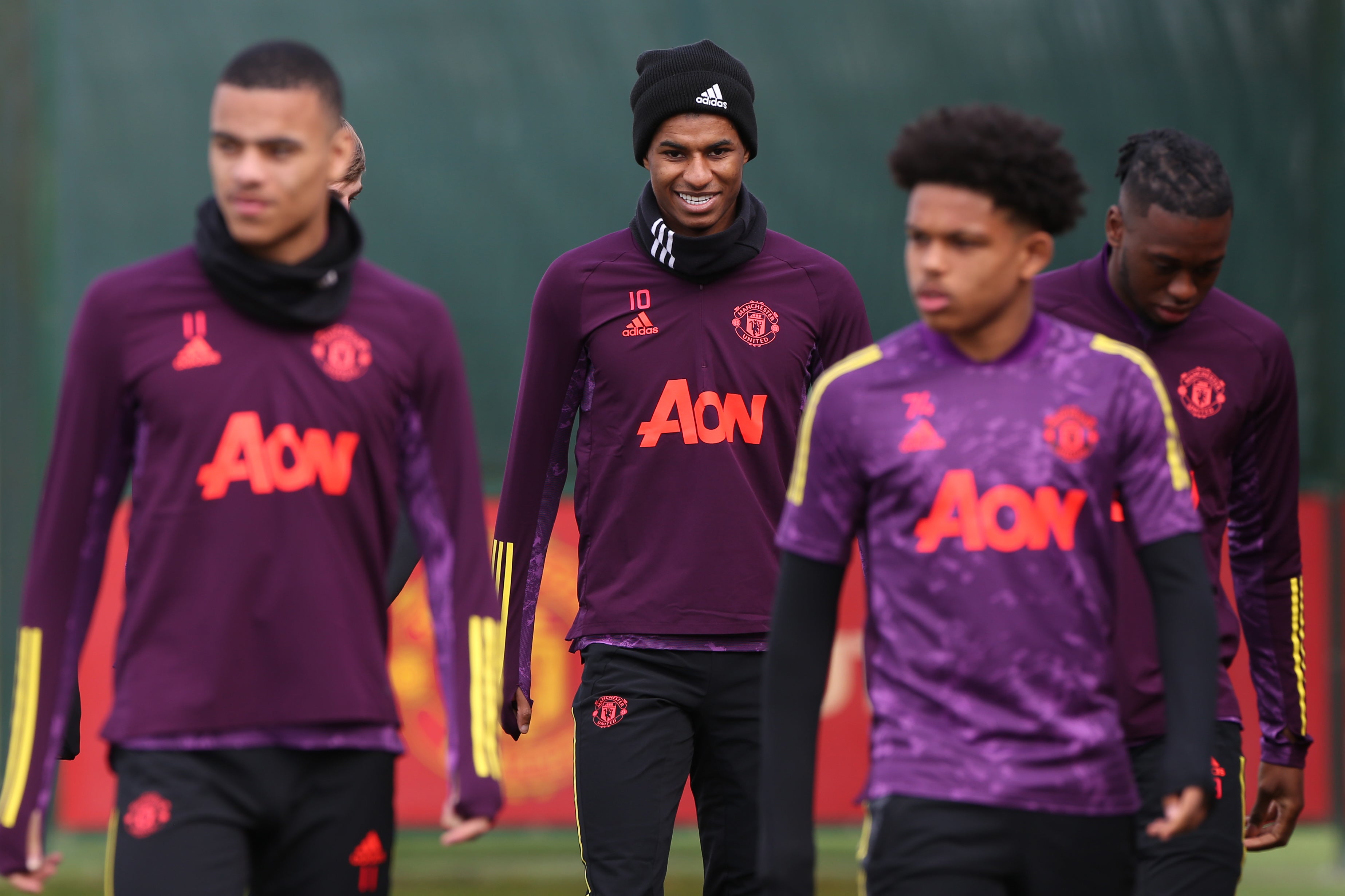 Rashford (centre) in training with his United team-mates