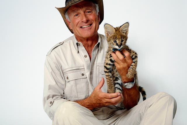 Jack Hanna poses for a portrait with a serval cub on 12 October 2015 in New York