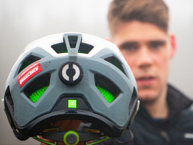 Amateur rugby player Euan Bowen with his cycle helmet with HIT Impact technology
