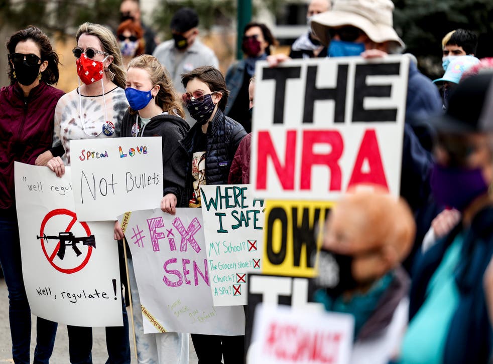 <p>File image: People link arms at a gun reform rally at the Colorado State Capitol on 28 March, 2021 in Denver, Colorado </p>