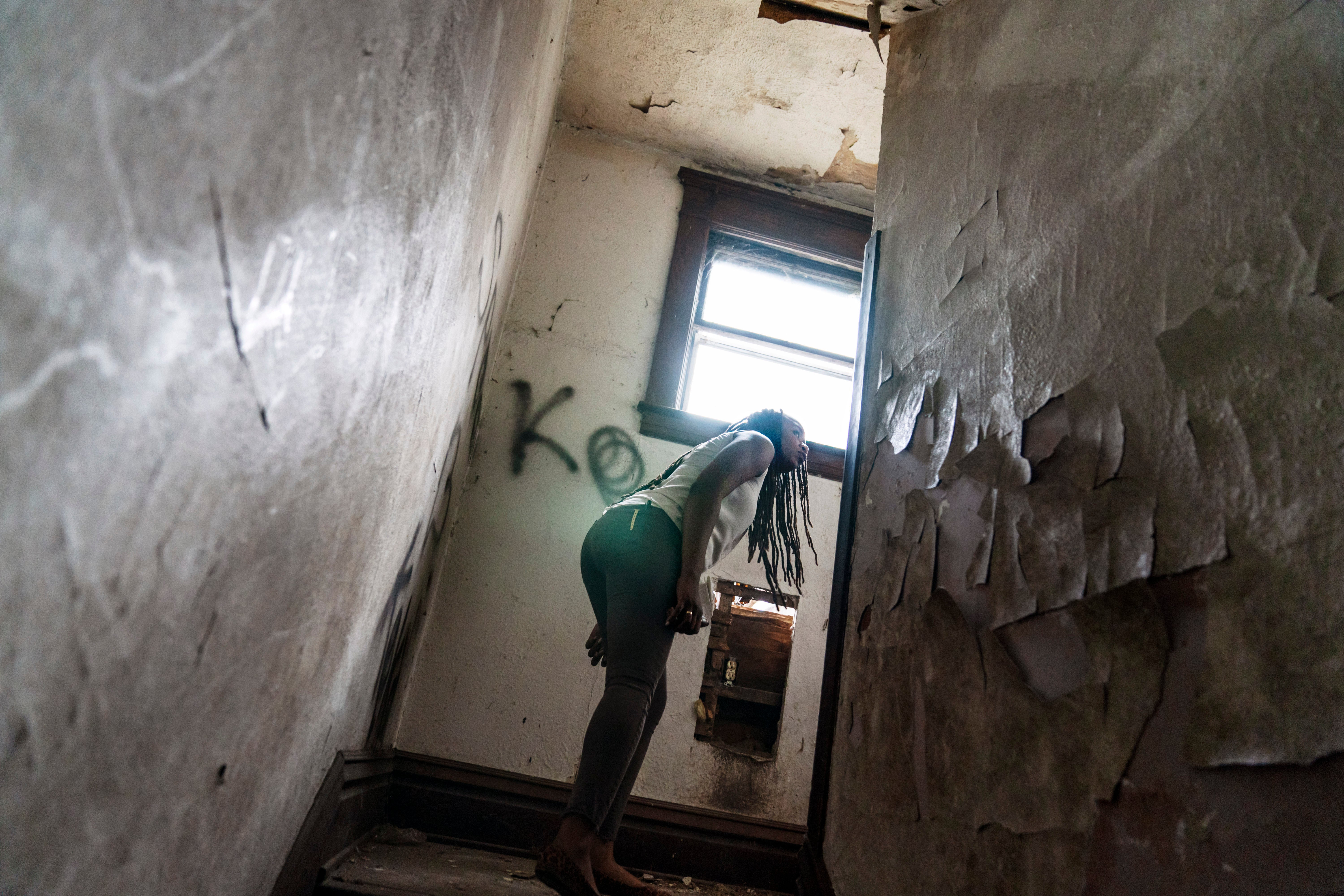 An overdose response team looks around an abandoned home in West Virginia