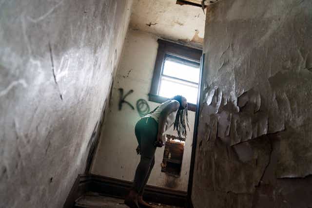 <p>An overdose response team looks around an abandoned home in West Virginia</p>
