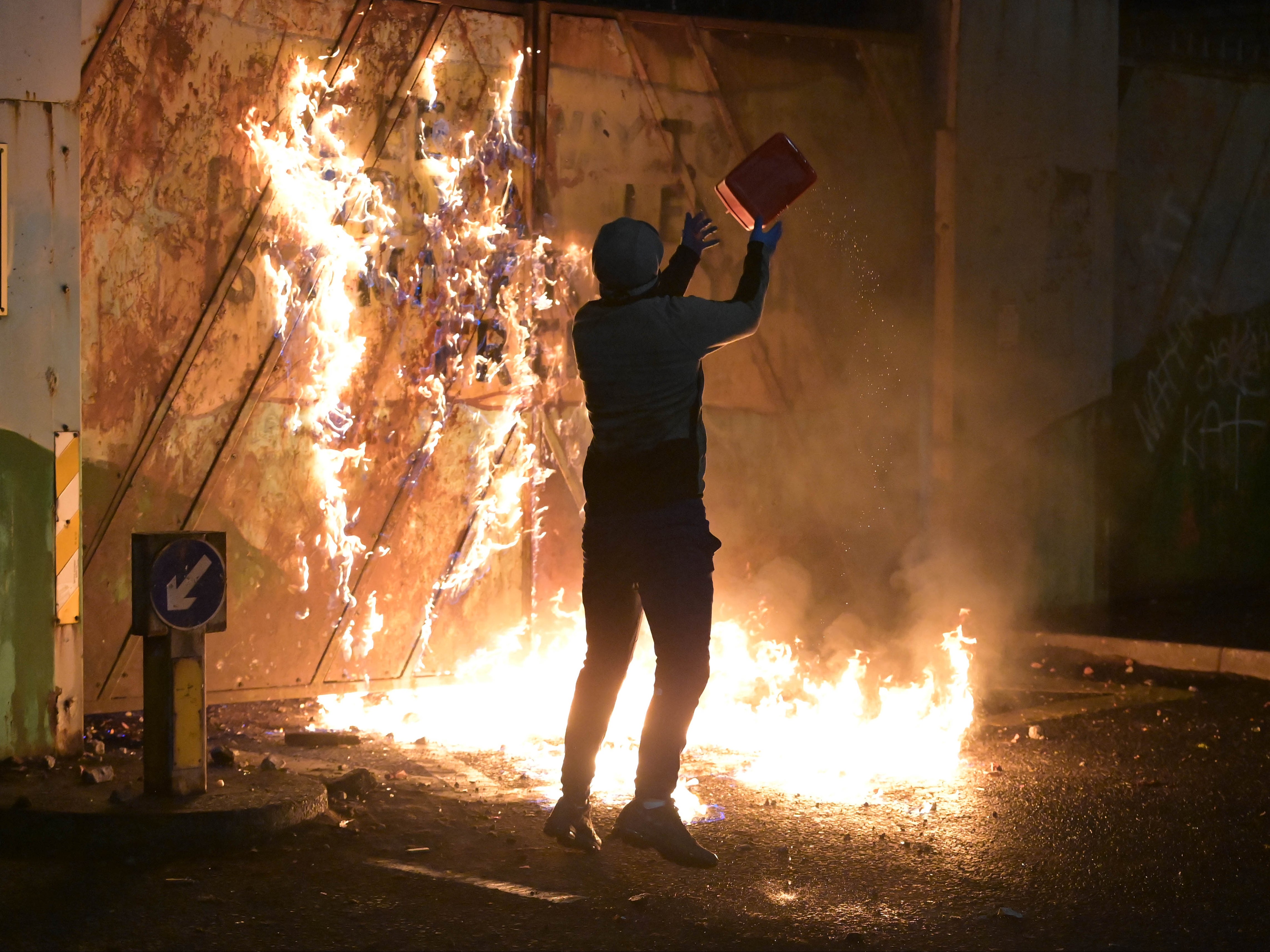 A person with a canister of liquid in Belfast on 7 April