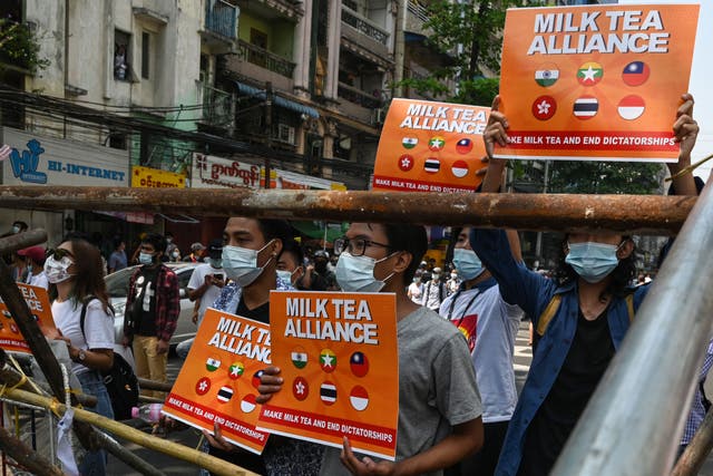 <p>File image: Protesters in Yangon, Myanmar holding signs relating to the ‘Milk Tea Alliance’ during a demonstration against the military coup</p>