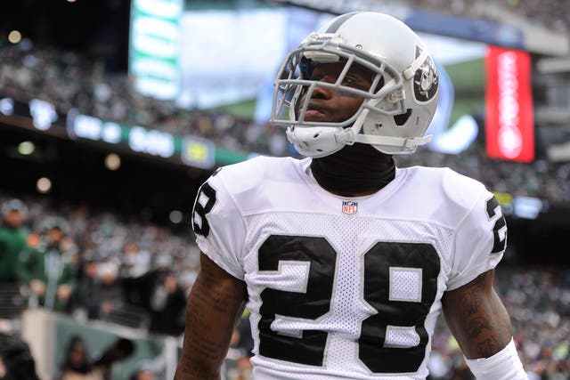 <p>Phillip Adams #28 of the Oakland Raiders looks into the crowd during the first half against the New York Jets at MetLife Stadium on 8 December 2013 in East Rutherford, New Jersey</p>