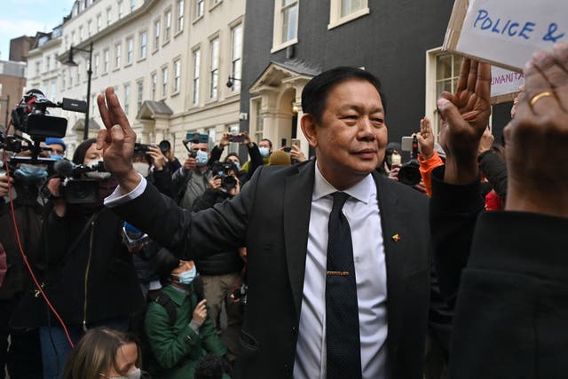 <p>Ambassador Kyaw Zwar Minn gestures outside the Myanmar embassy in London on Thursday</p>