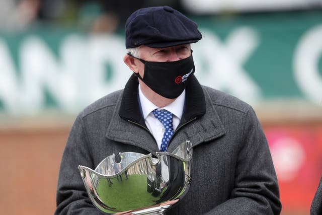 Sir Alex Ferguson with the trophy after Clan Des Obeaux won the Bowl Chase