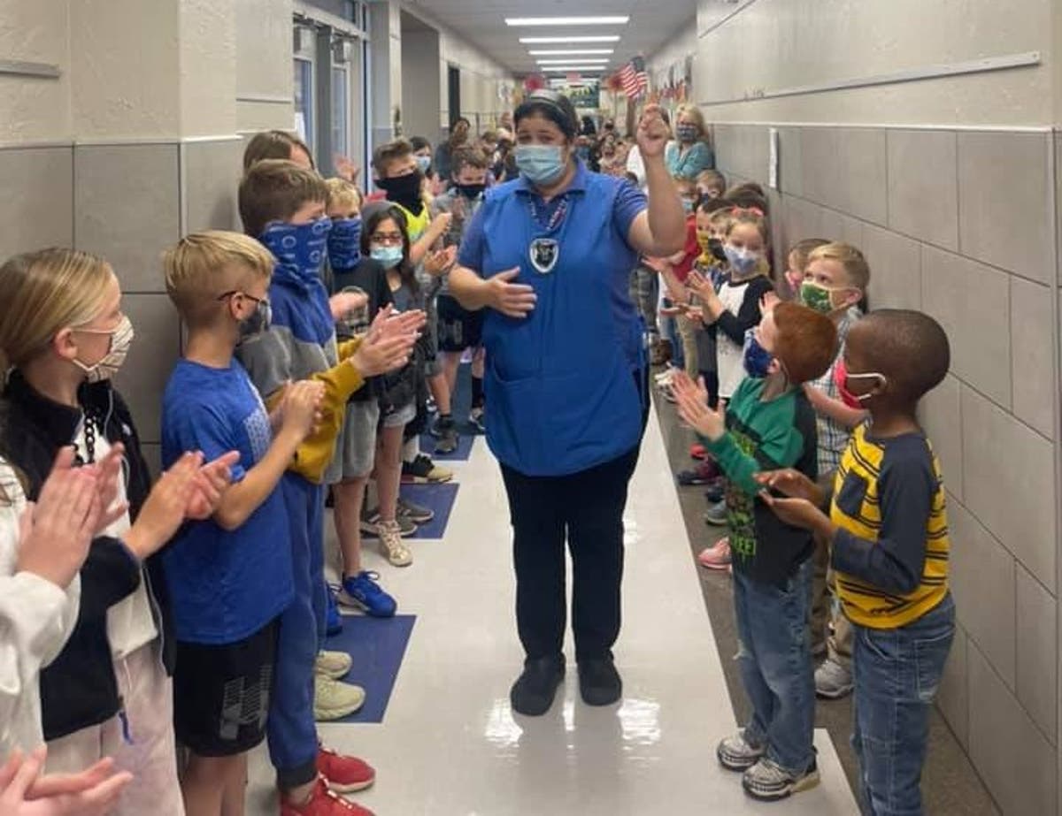 Touching moment elementary children applaud school worker for passing citizenship test