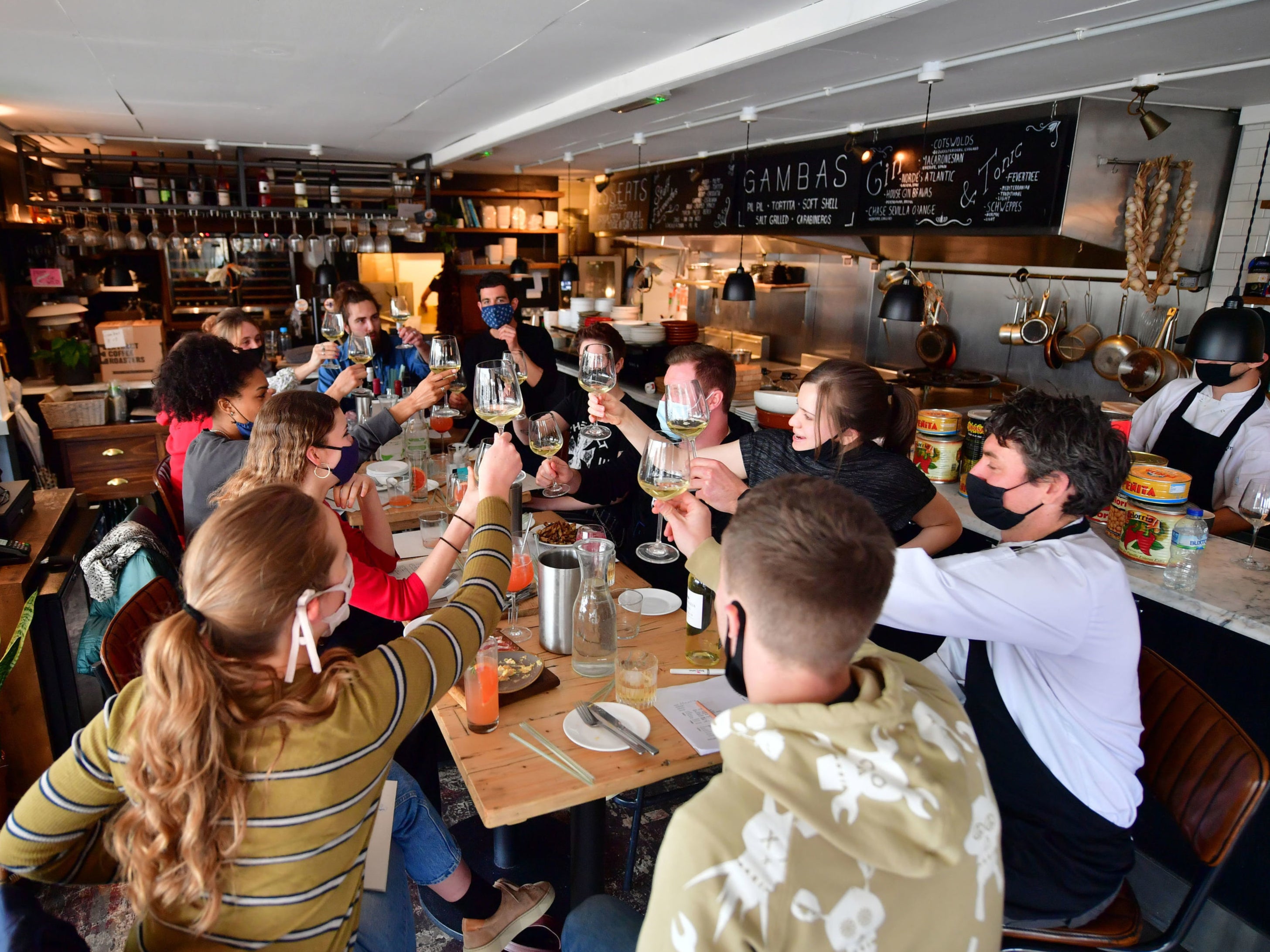 Members of staff take part in a menu tasting at Gambas Tapas Bar in Wapping Wharf, Bristol, as they prepare to reopen for outdoor dining on 12 April when further lockdown restrictions are eased in England