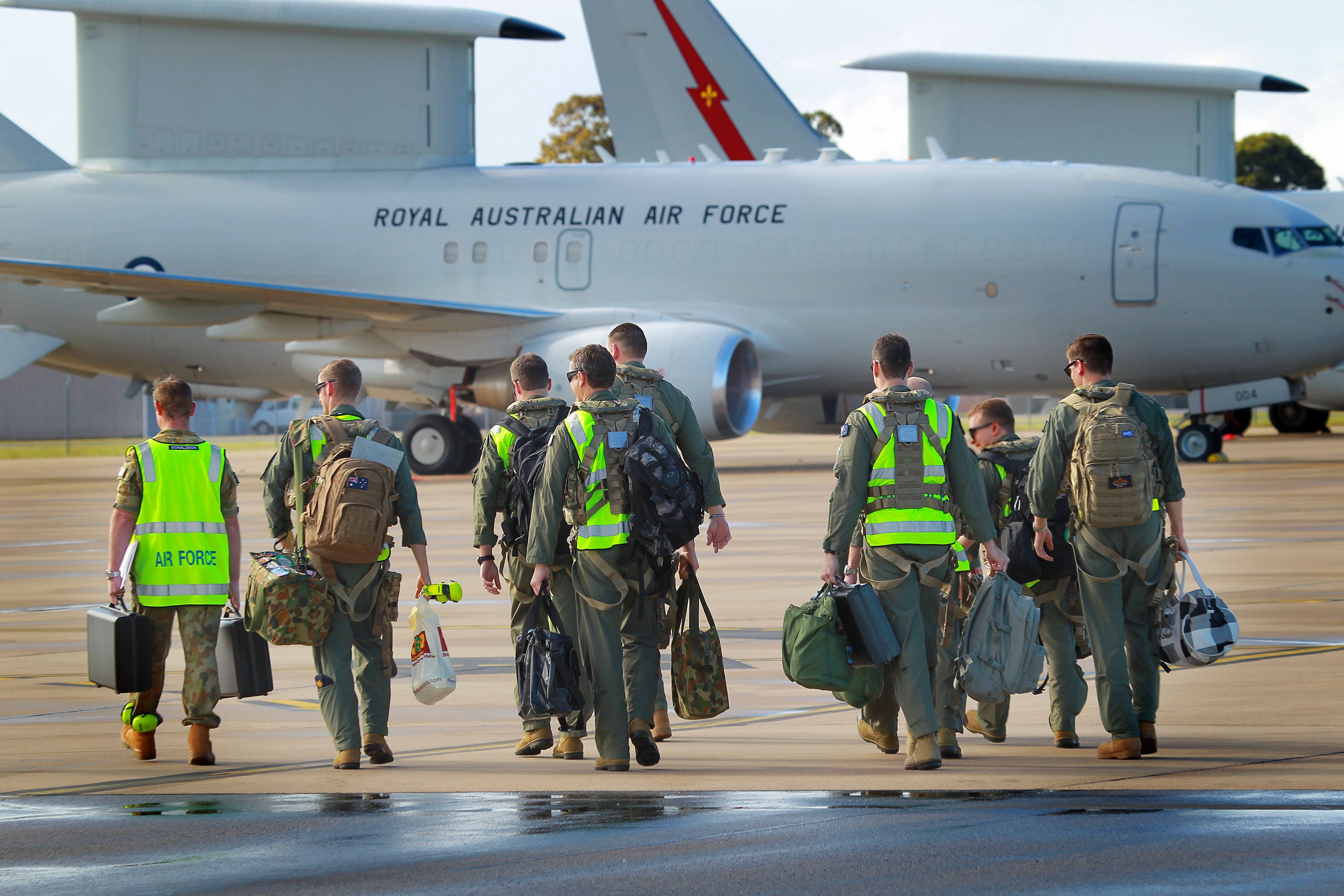 In this handout image provided by Commonwealth of Australia, air crew prepare to board the the E-7A Wedgetail Airborne Early Warning and Control aircraft for deployment to the Middle East on September 21, 2014 in Williamtown, Australia. RAAF has decided to ban gendered terms like ‘airmen’ and rather use ‘aviators’