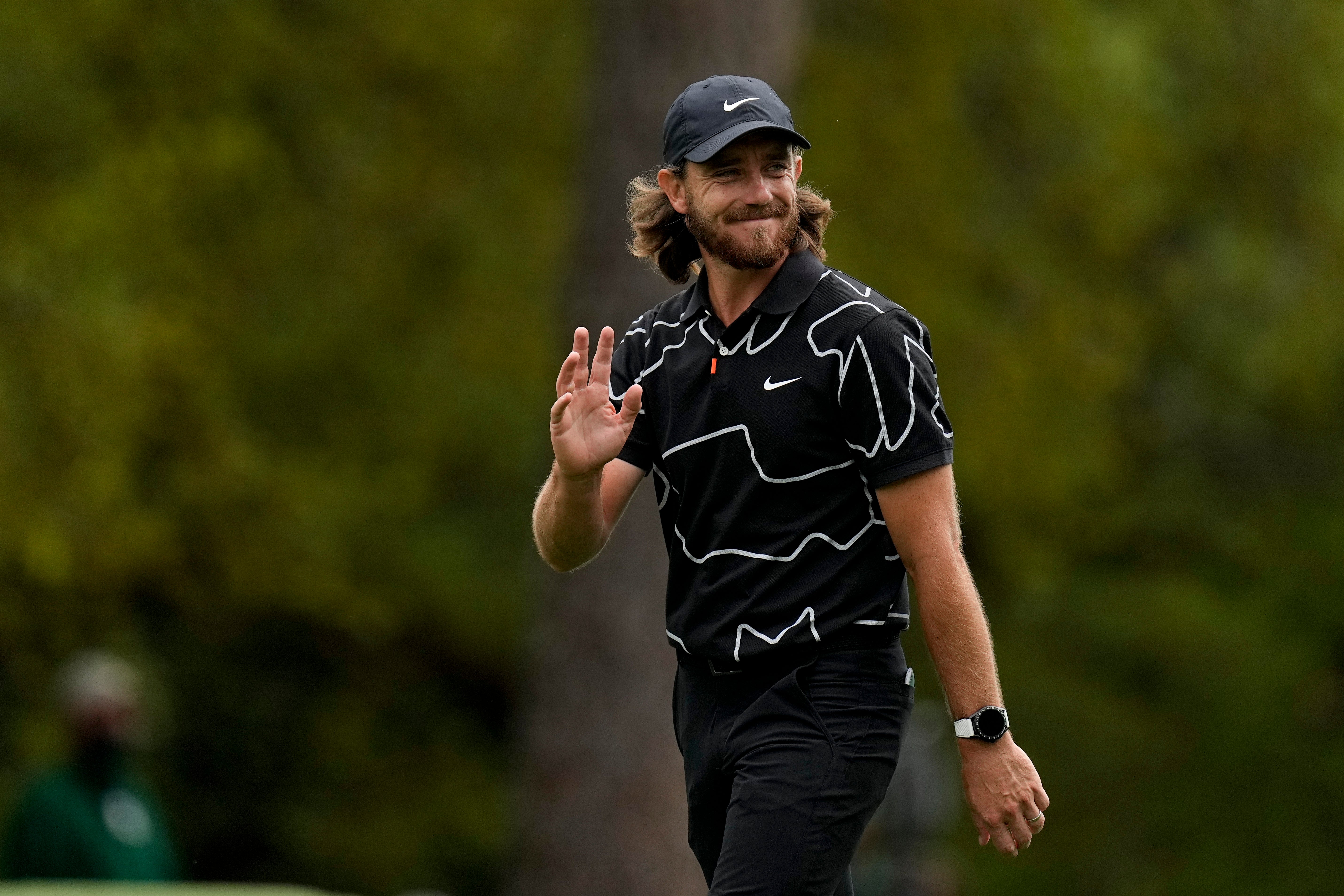 Tommy Fleetwood salutes the crowd after clinching a hole in one
