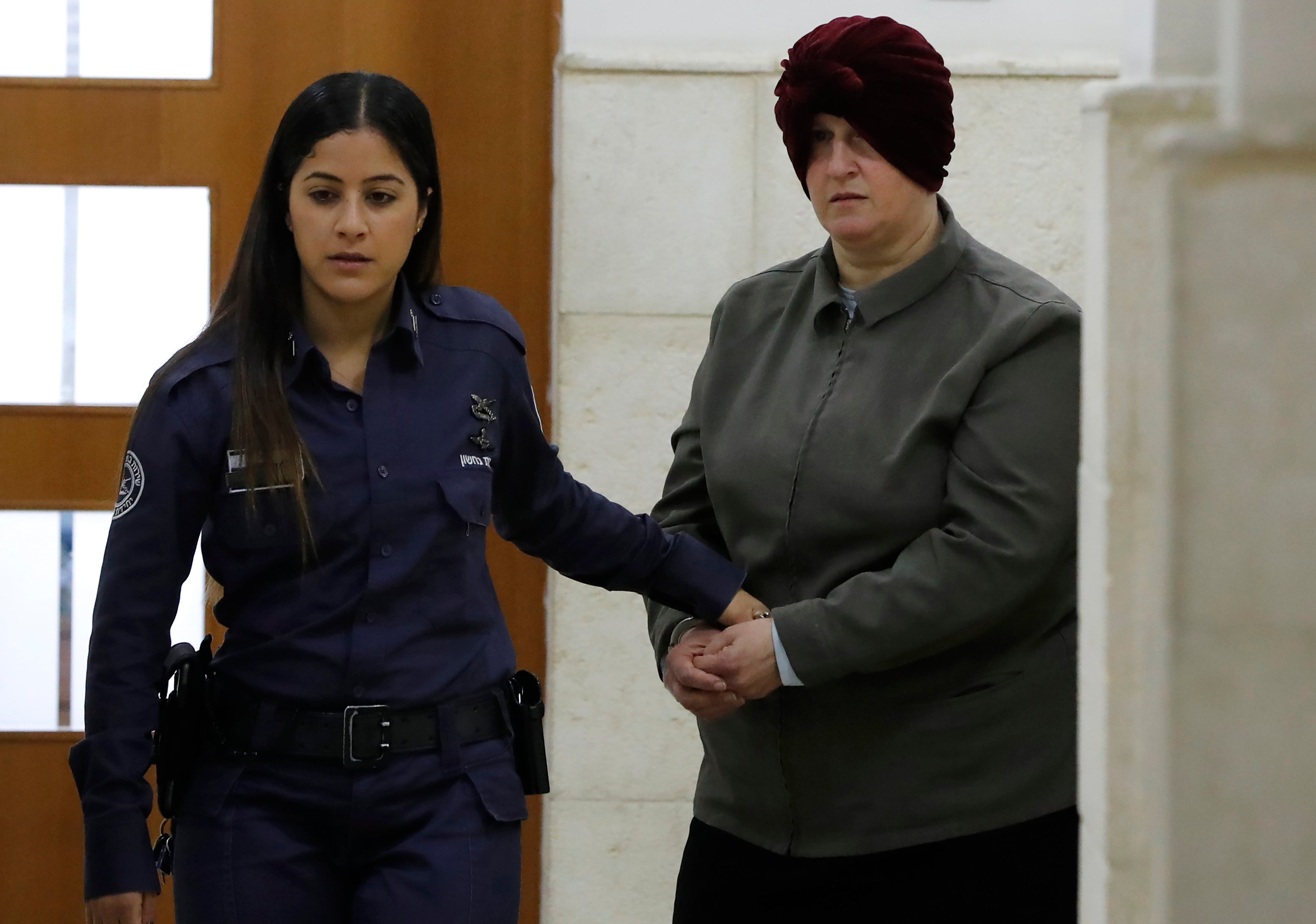 In this file photo taken on 27 February 2018, Malka Leifer, a former Australian teacher accused of sexual abuse of girls at a school, arrives for a hearing at the District Court in Jerusalem