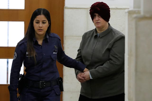 <p>In this file photo taken on 27 February  2018, Malka Leifer, a former Australian teacher accused of sexual abuse of girls at a school, arrives for a hearing at the District Court in Jerusalem</p>