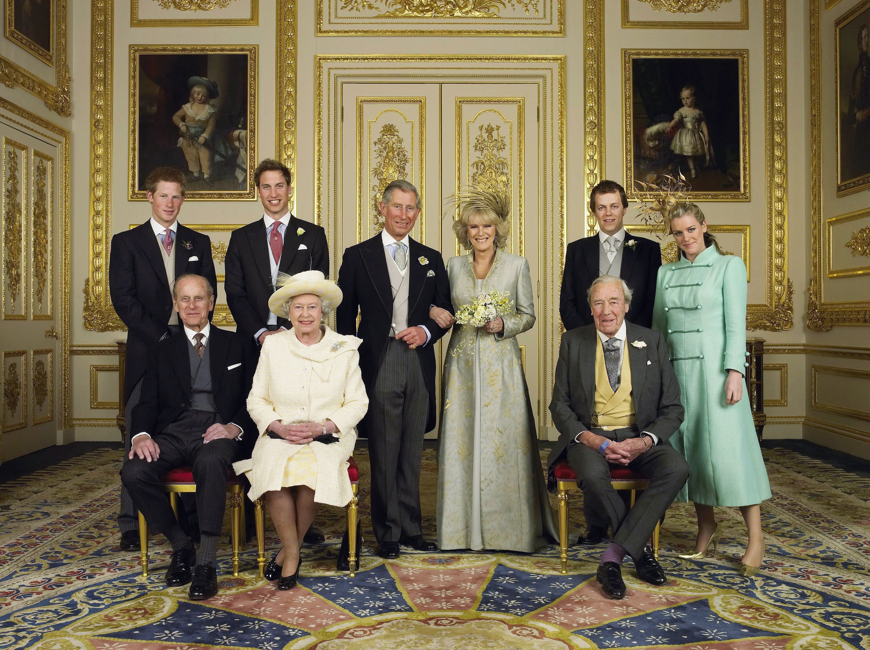 the Prince of Wales and his new bride Camilla, Duchess of Cornwall, with their families (L-R back row) Prince Harry, Prince William, Tom and Laura Parker Bowles (L-R front row) Duke of Edinburgh, Britain's Queen Elizabeth II and Camilla's father Major Bruce Shand, in the White Drawing Room at Windsor Castle after their wedding ceremony, April 9, 2005 in Windsor, England