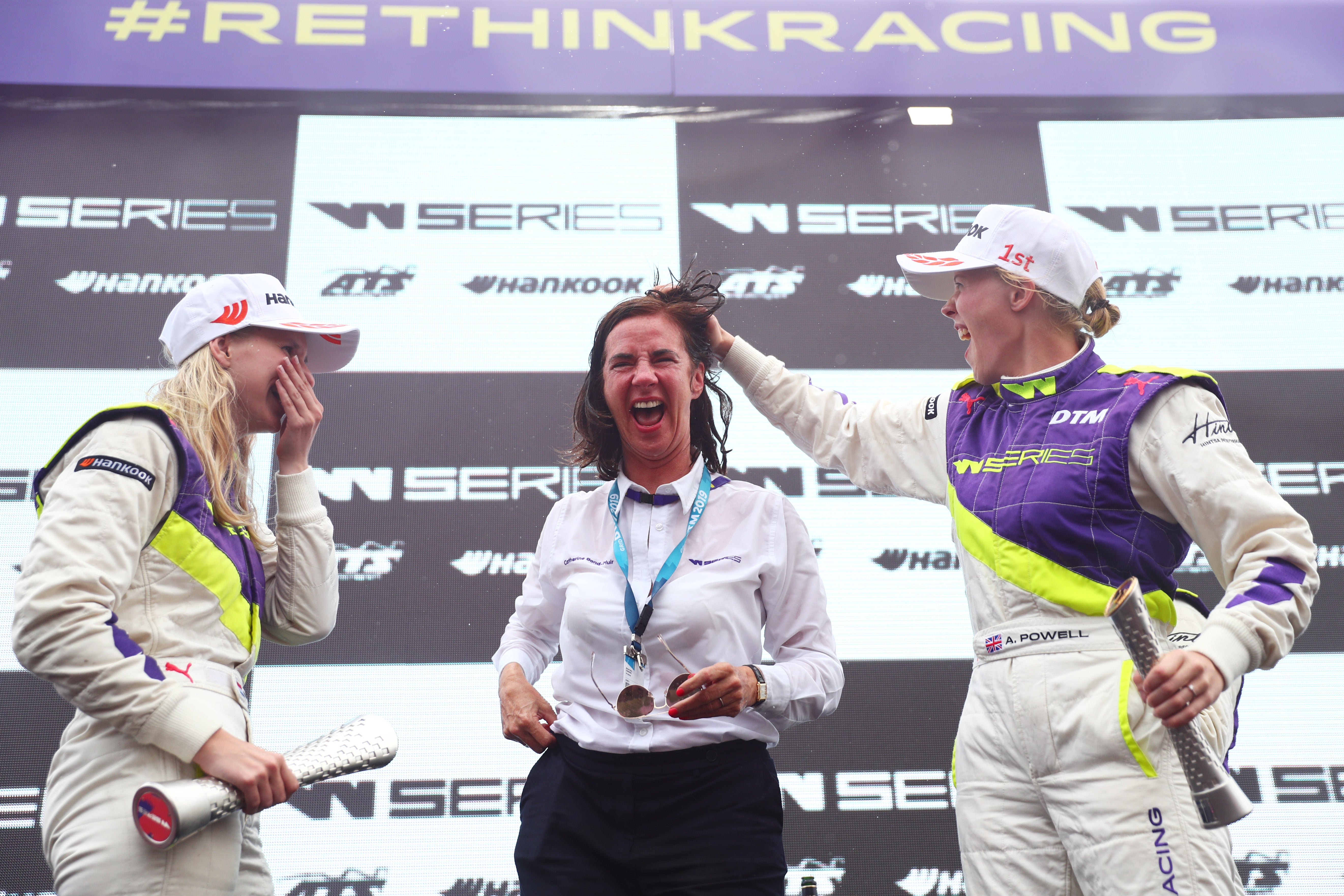 W Series CEO, Catherine Bond Muir, celebrates on the podium with Beitske Visser and Alice Powell