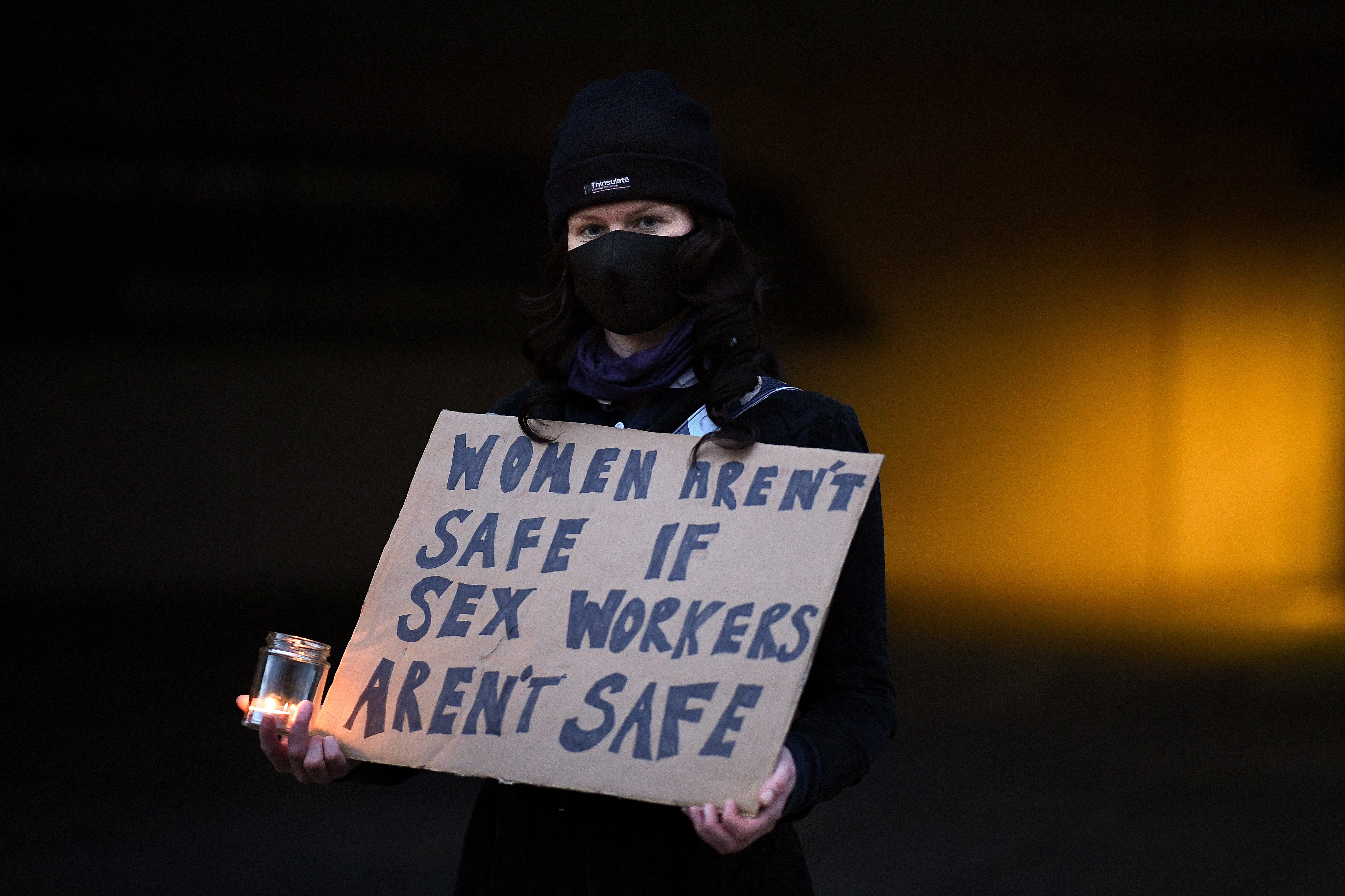 <p>Sex workers and campaigners hold vigil outside Scottish Parliament on 25 November in Edinburgh </p>