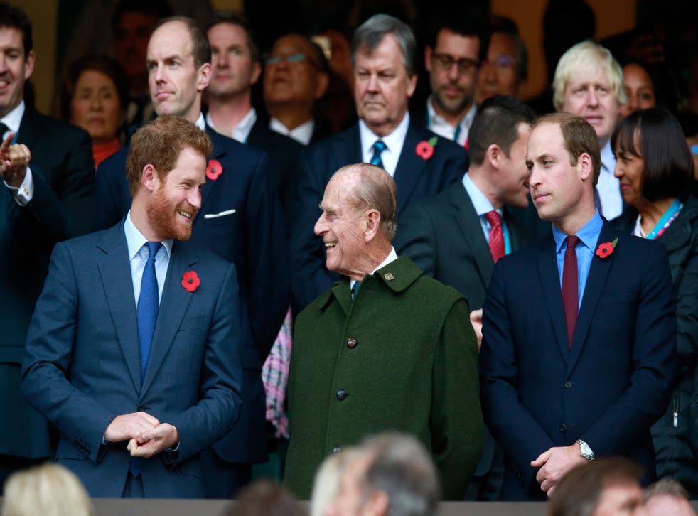 Prince Harry, Prince Phillip and Prince William enjoy the atmosphere during the 2015 Rugby World Cup Final match between New Zealand and Australia at Twickenham Stadium on October 31, 2015