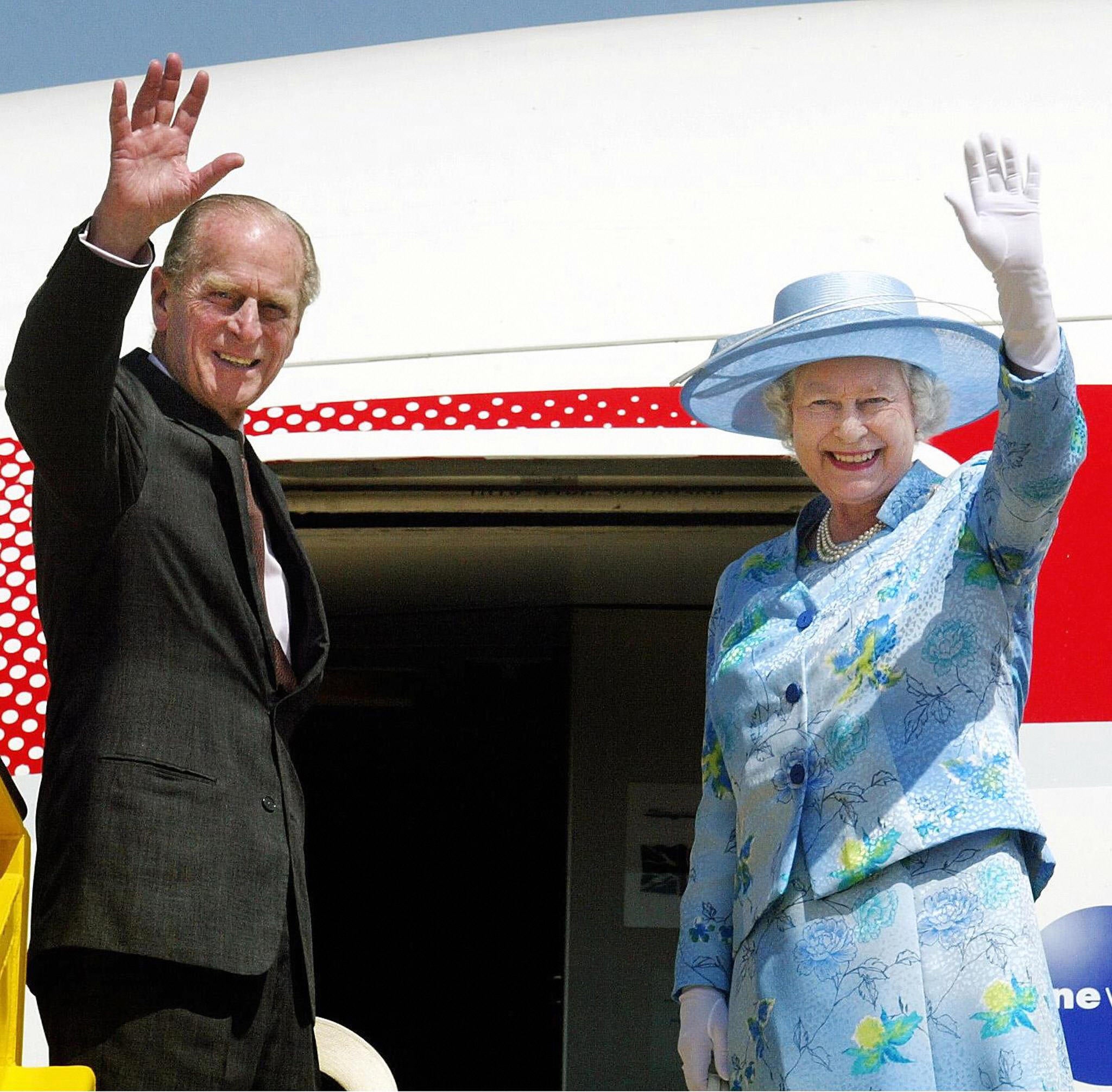 The Queen and the late Prince Philip board a plane in Abuja