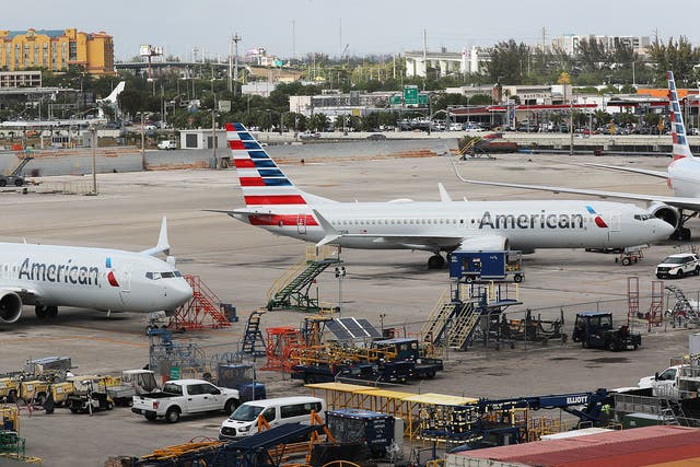 <p>Two grounded American Airlines Boeing 737 Max 8 are seen parked at Miami International Airport on 14 March 2019 in Miami, Florida</p>