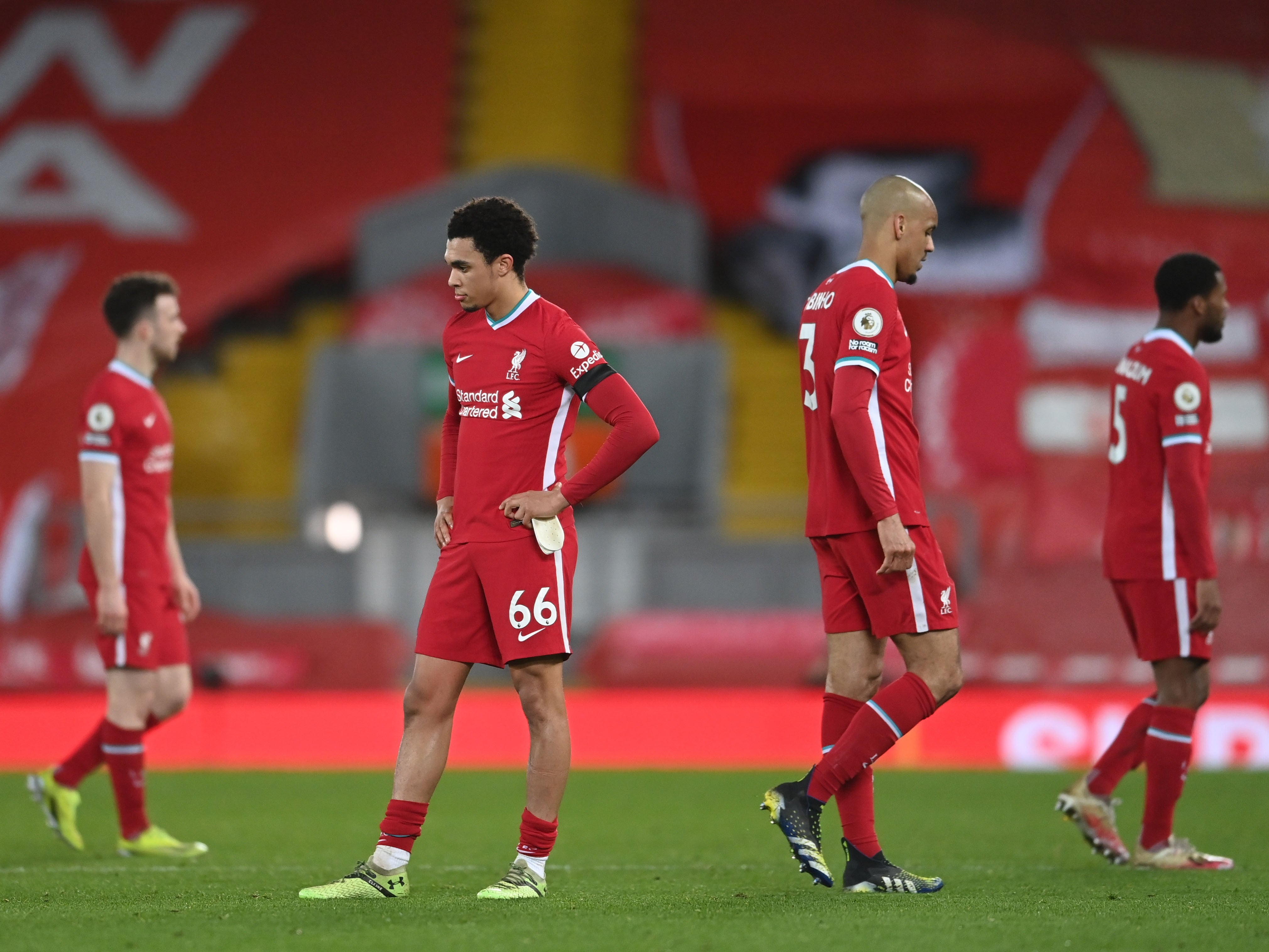 Liverpool players look dejected at Anfield