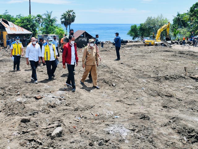 <p>Indonesian President Joko Widodo visits an area affected by flash floods triggered by a tropical cyclone Seroja</p>