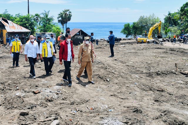 <p>Indonesian President Joko Widodo visits an area affected by flash floods triggered by a tropical cyclone Seroja</p>