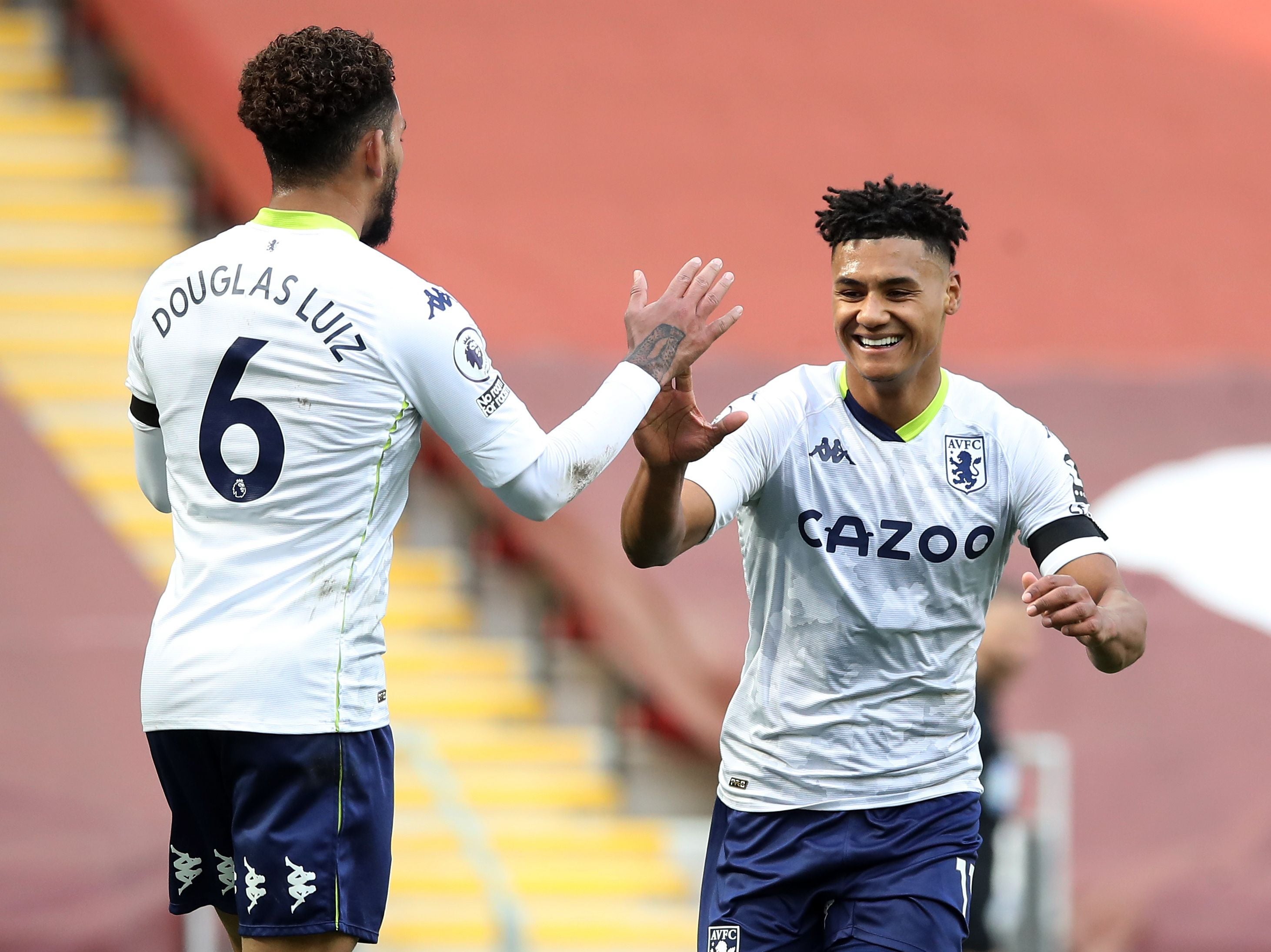 Aston Villa celebrate taking the lead at Anfield