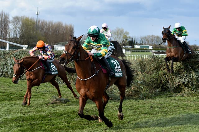 <p>Rachael Blackmore, riding Minella Times, clears the last fence to win the 2021 Grand National</p>