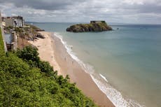 Unconscious man pulled from sea after tombstoning in Wales, say police