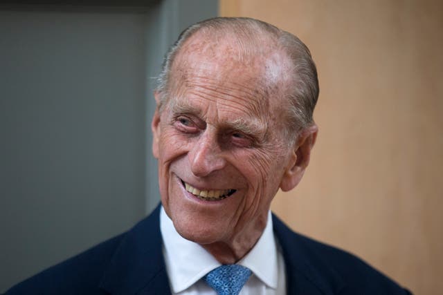 Prince Philip, the husband of Queen Elizabeth II, smiles after unveiling a plaque at the end of his visit to Richmond Adult Community College in Richmond