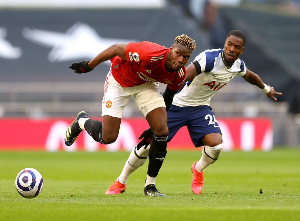 Paul Pogba contests for the ball with Serge Aurier