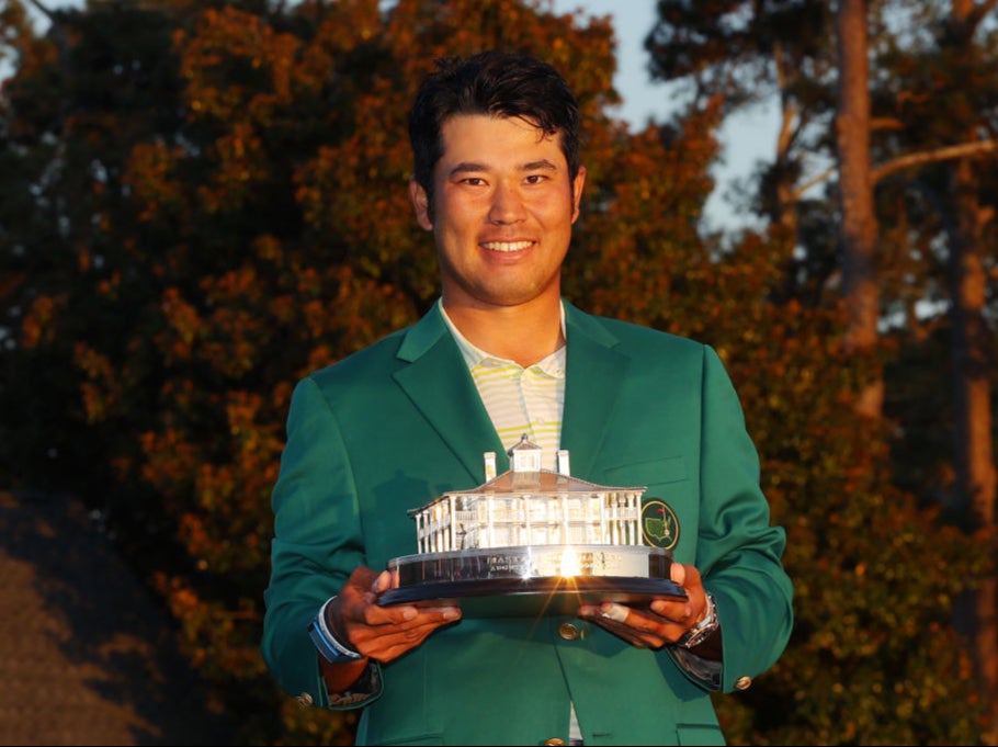 Hideki Matsuyama poses with the trophy