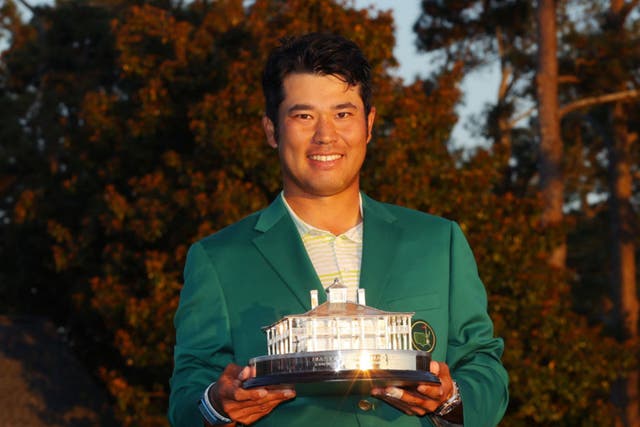 Hideki Matsuyama poses with the trophy