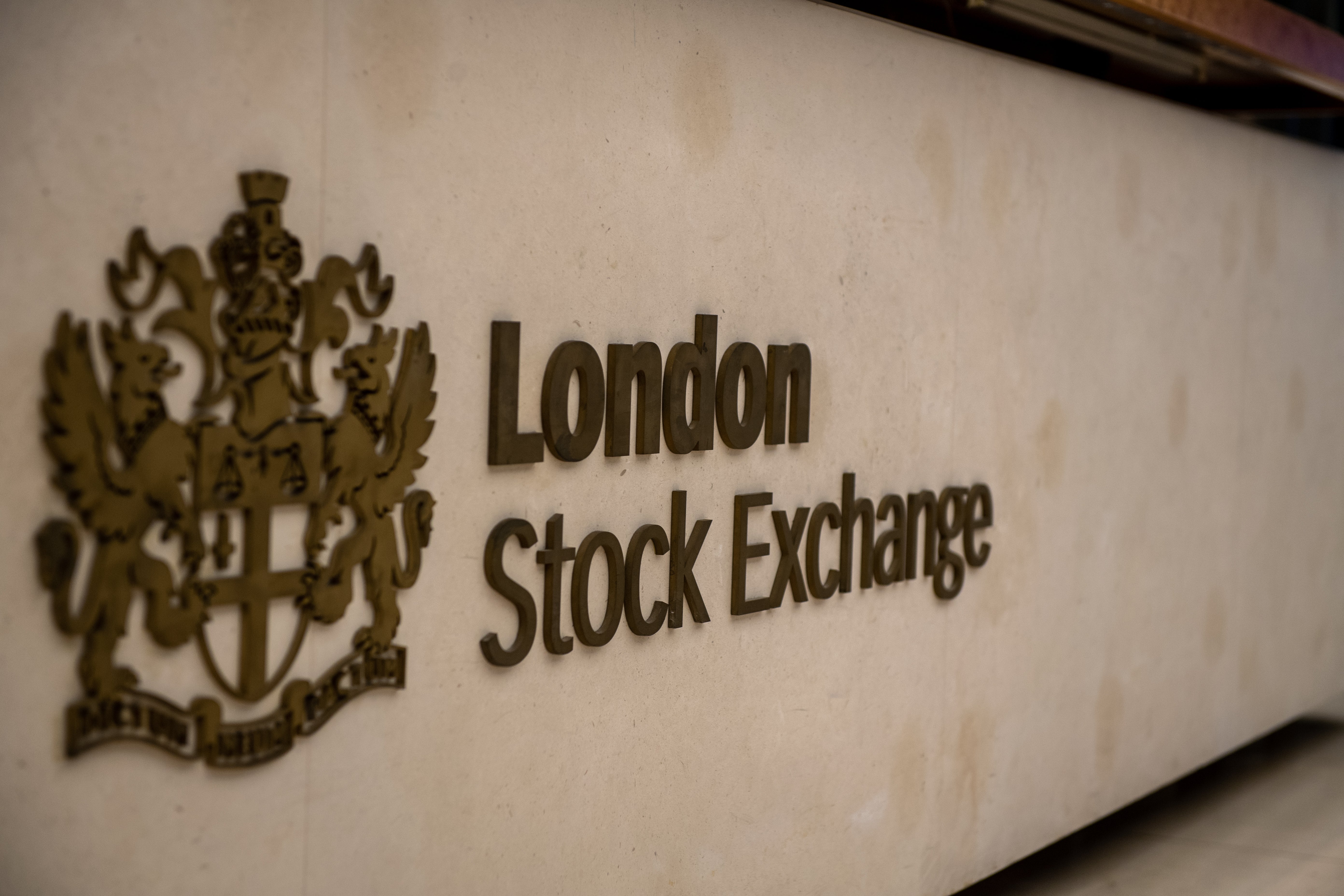 FTSE 100 closes lower after a strong week but US stocks continue to rise