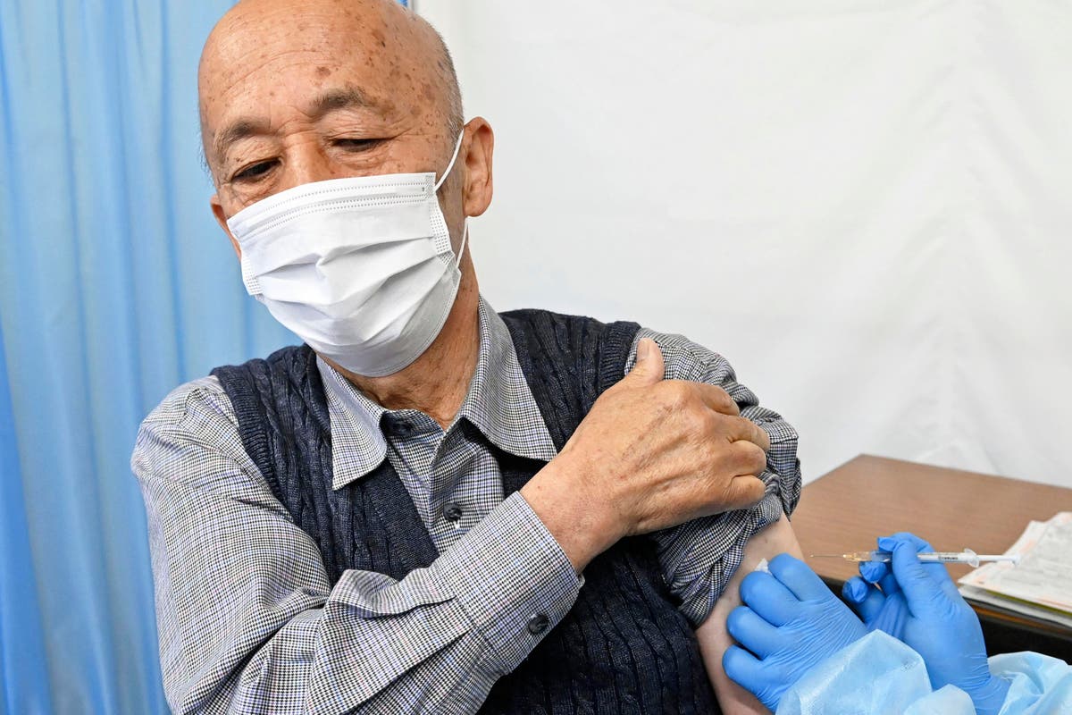 Tokyo adopts tougher virus rules, starts vaccinating elders