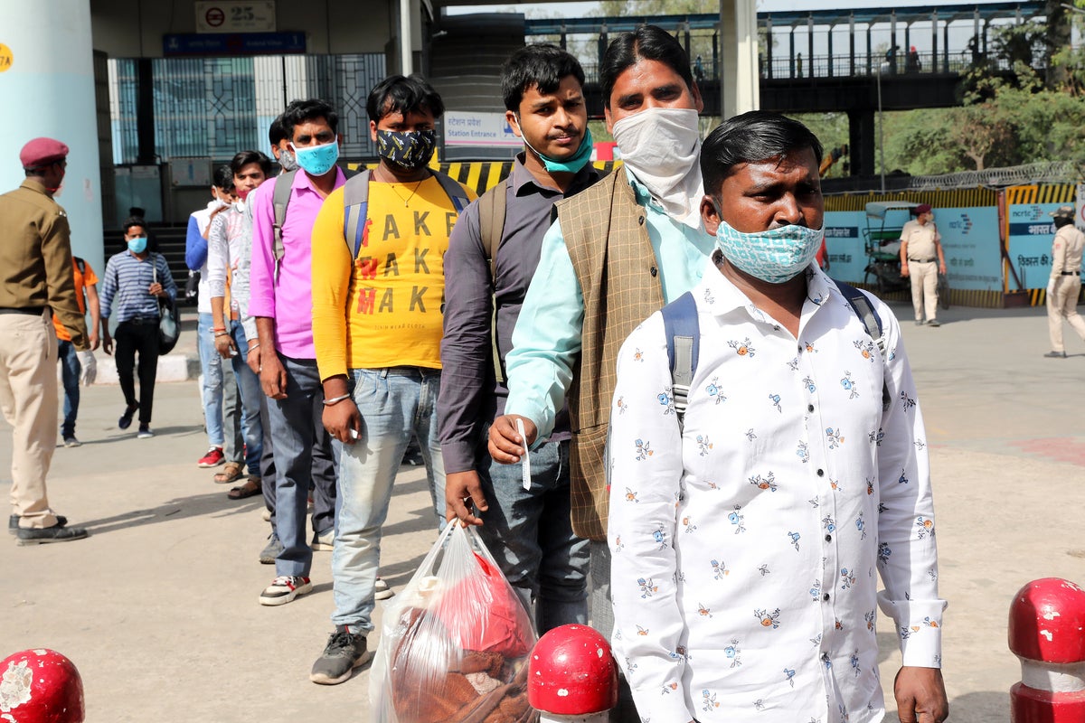 Surge in migrant workers leaving Delhi as spectre of another lockdown ...