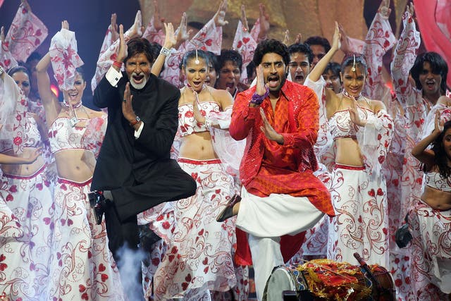 <p>File image: Bollywood actors Amitabh Bachchan and his son Abhishek Bachchan perform on stage at the International Indian Film Academy Awards </p>