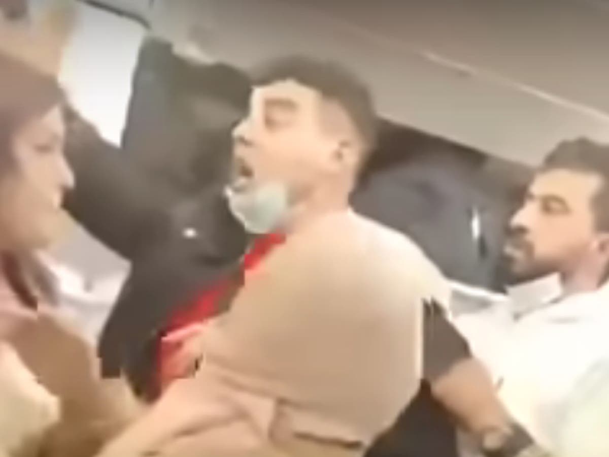 Passengers brawl in plane aisle in row over overhead bin