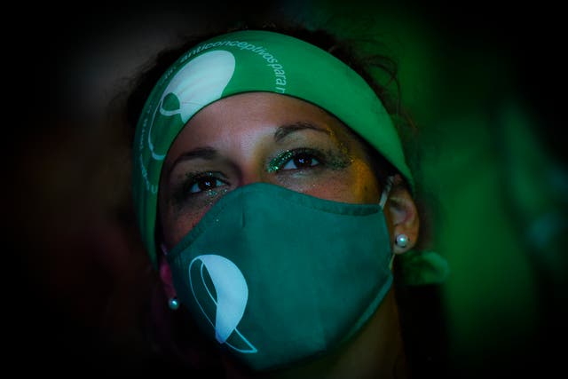 <p>Demonstrator in Buenos Aires in Argentina just before  abortion was legalised in a landmark vote in December</p>