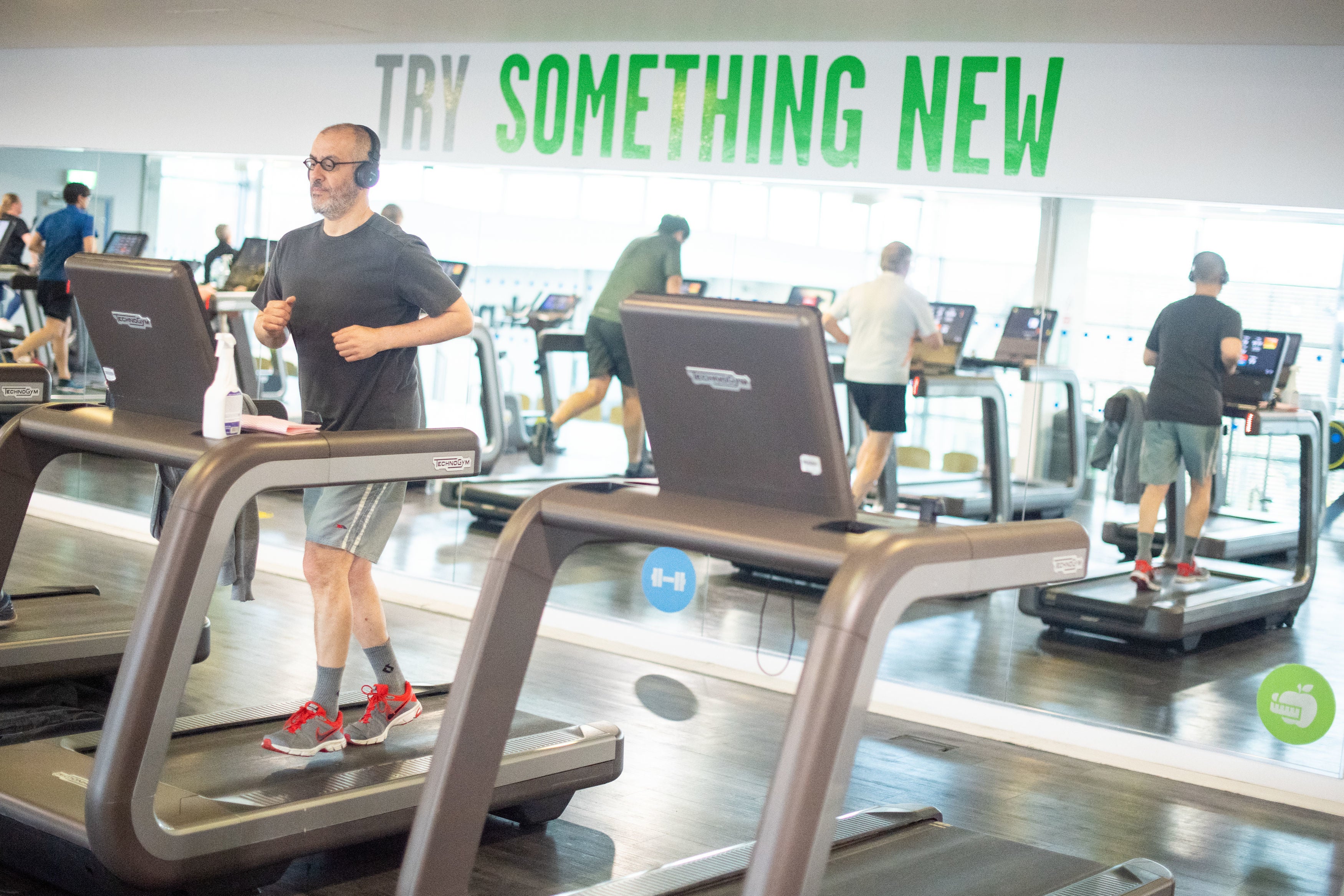 People exercise in the gym at Clissold Leisure Centre, north London, which reopened to the public on 12 April